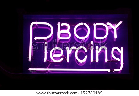 Neon Purple body piercing sign studio cutout