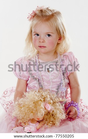 beautiful little girl dressed in pink fairy princess costume against white background