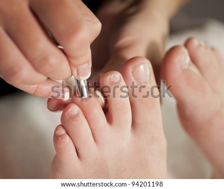 cuticles being pushed back during pedicure