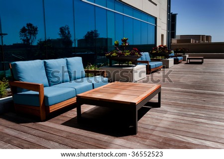 Image of modern outdoor furniture on wooden deck