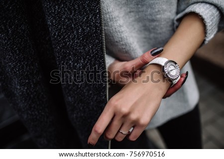 white women\'s wrist watch on the girl\'s hand