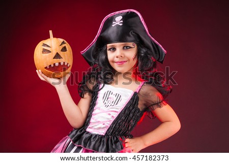 a little girl dressed as a pirate