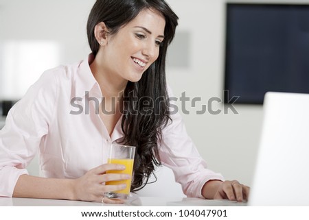 Girl using laptop at home to chat with friends