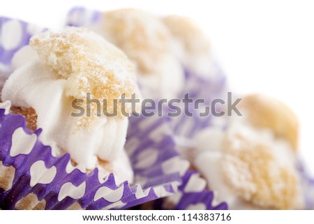 Freshly baked cup cakes with cream filling in cake trays