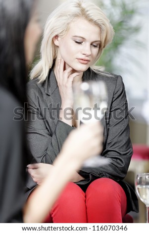 attractive woman waiting for someone at a wine bar.
