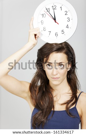 Woman expressing concept of time hanging over her.