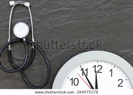 Concept showing doctors stethoscope and a clock face simulating an appointment