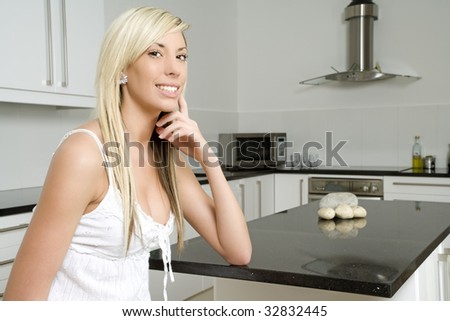 Woman relaxing in her kitchen