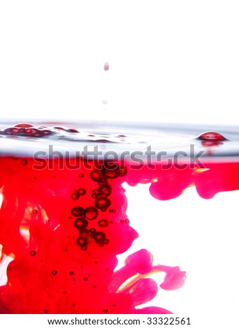 Red dye in water with white background