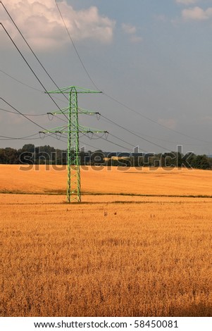 Rural, farmland landscape with high voltage electricity power line.