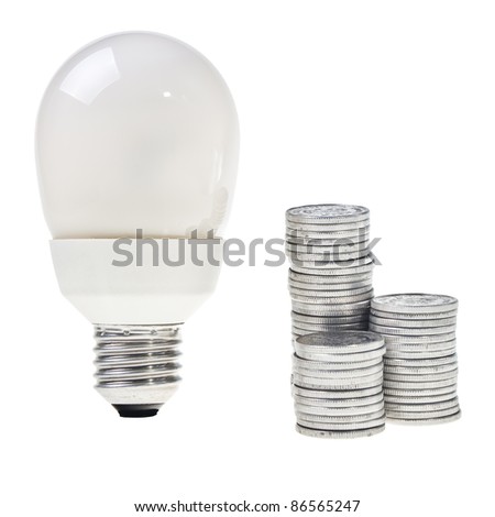 Power saving energy lightbulb over white background with stacked silver coins.