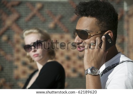 man on she phone while she gets angry