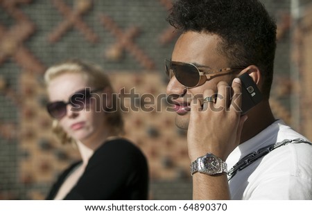he is on the phone while she gets angry