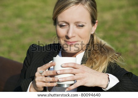 Beautiful business Woman with cup of Coffee outdoor 597
