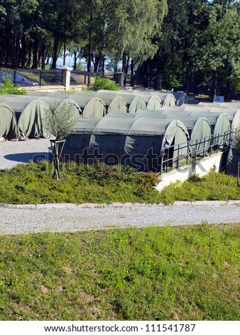 several large military tents as a camp for junior