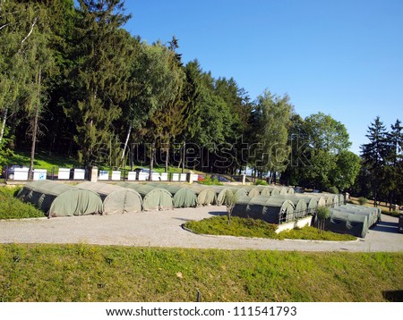 several large military tents as a camp for junior