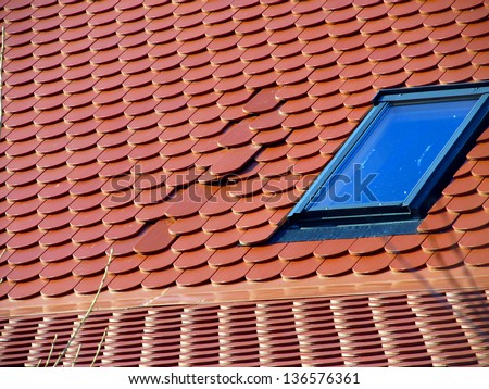 part of the red roofs of wrongly laid tile - error in execution of construction works