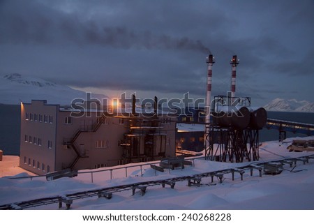 View of the Russian mining settlement on Spitsbergen in the far north during the polar night, the view from the top of the boiler house chimney visible