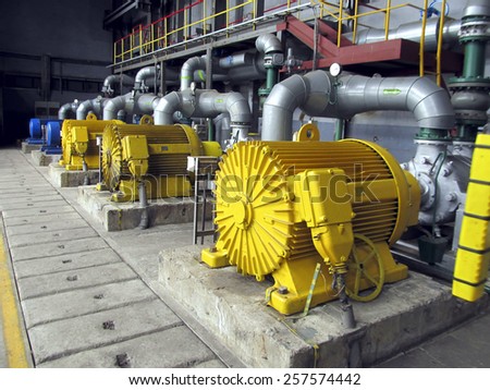 several water pumps with large electric motors