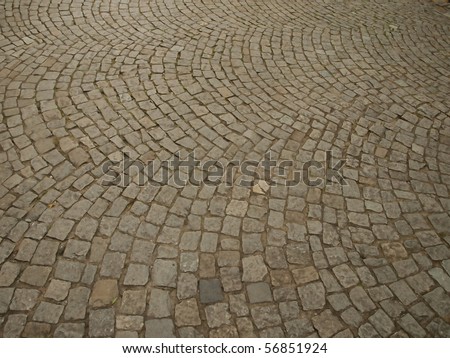 stone as raw material for the construction of roads, streets, sidewalks, and background and texture
