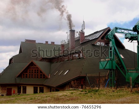 smoke coming from the chimney mountain hut on Pilsko in the Beskid Mountains, Poland