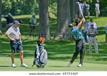 MAMARONECK, NY - JUNE 13: Tiger Woods hits an approach shot as he prepares to play, but missed the cut, in the 2006 US Open at Winged Foot on June 13, 2006 in Mamaroneck, NY.