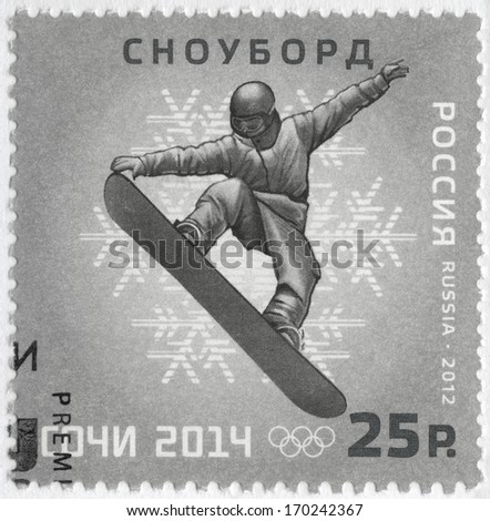 RUSSIA CIRCA 2012 A stamp printed in Russia shows XXII Olympic Winter Games in Sochi 2014 Olympic winter Sports snowboarding circa 2012 RUSSIA CIRCA 2012 A stamp printed in Russia shows XXII Olympic Winter Games in Sochi 2014 Olympic winter Sports snowboarding circa 2012