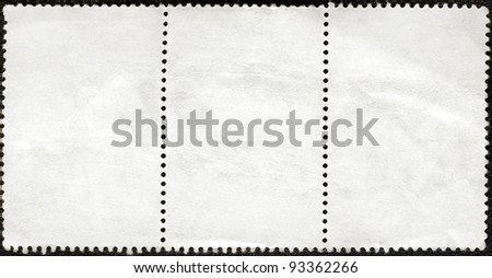 Blank postage stamps block of three framed on a black background