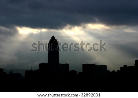 Through clouds on the city light flows