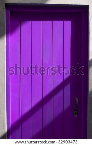 purple door with shadow