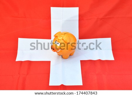 Piggy bank on the Swiss flag