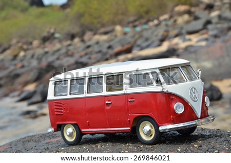 PHUKET, THAILAND - MARCH 27, 2015: Miniature VW Bulli 1962 on the rock. The cult car of the Hippie generation and it remained the status vehicle of the high wave surfers