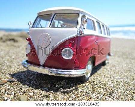 Miniature VW Bulli 1962 on the beach. The cult car of the Hippie generation and it remained the status vehicle of the high wave surfers