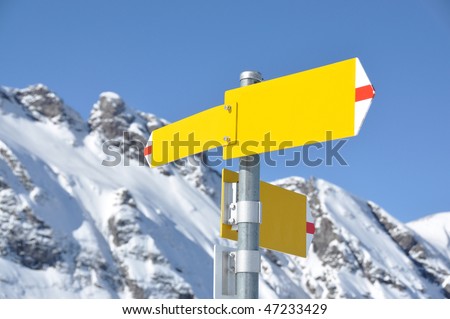 Empty sign-board against mountain scenery