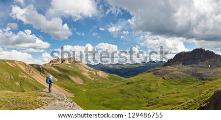 Outdoor Adventure Panorama. Hiker enjoys grand view of alpine tundra in Colorado, USA.