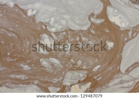 Puddle of dirty, brown, muddy water