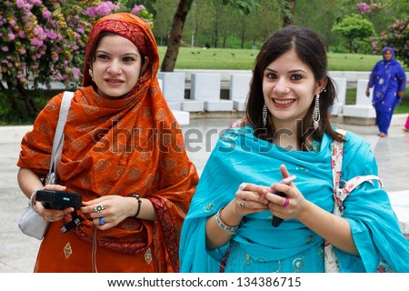 ISLAMABAD - JULY 16: Two unidentified Pakistani tourists on July 16, 2011 in Islamabad. Despite security concerns and mismanagement, the tourism industry is a growing economic factor in Pakistan.