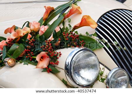 stock photo Closeup of Vintage Wedding Car Decorated with Flowers
