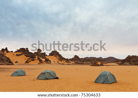 Three tents in the sand. Camping in the desert - Akakus (Acacus) Mountains, Sahara, Libya