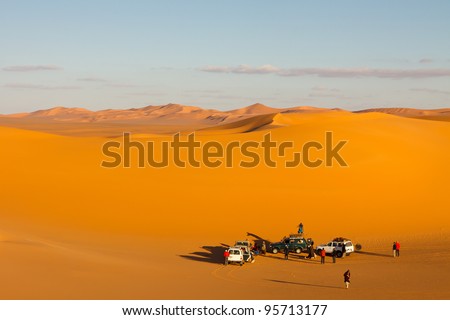 Tourist group in the sand sea of the Sahara Desert, Libya