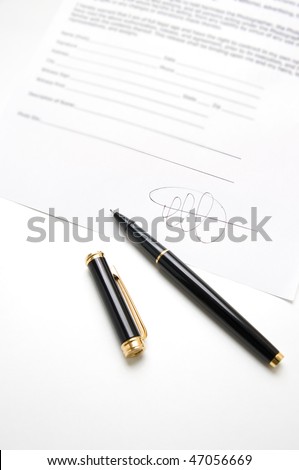 Black pen on a contract with signature