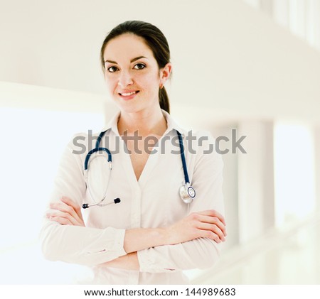 Medical doctor woman with stethoscope, isolated on white background