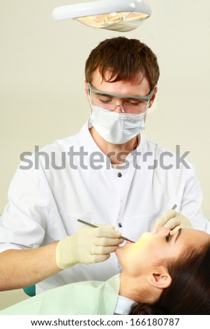 Young woman with dentist in a dental surgery. Healthcare, medicine
