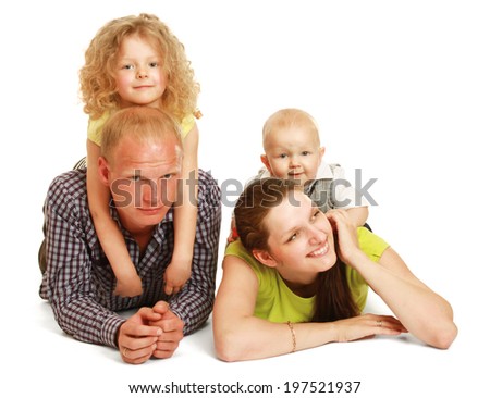 Peaceful family lying in circle on the wall-to