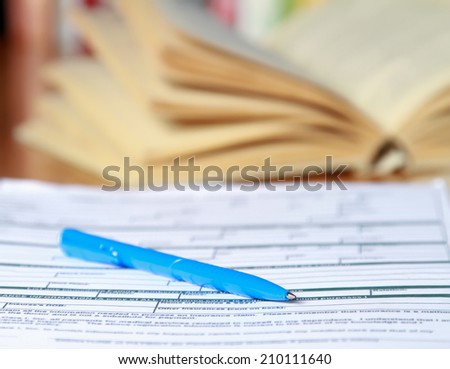 Book and page of document on the desk