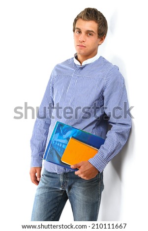Young college guy  holding a books