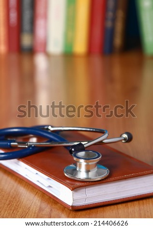 Stethoscope on book with leather cover