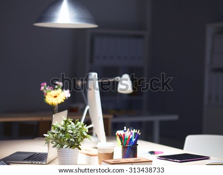 Designers desk with laptop