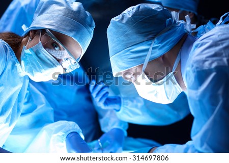 Team surgeon at work on operating in hospital