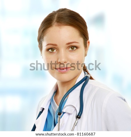 A portrait of a smiling female doctor - close-up indoors